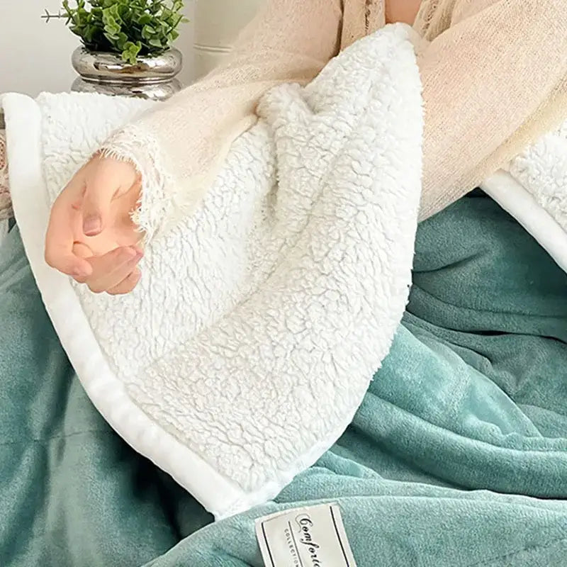White sherpa blanket with a soft textured surface and cream border for decorbites cozy imitation lamb’s wool bedroom decor