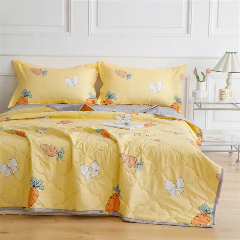 Yellow quilted bed set with orange carrots and white butterflies on yellow background with gray trim decorbites daisy print