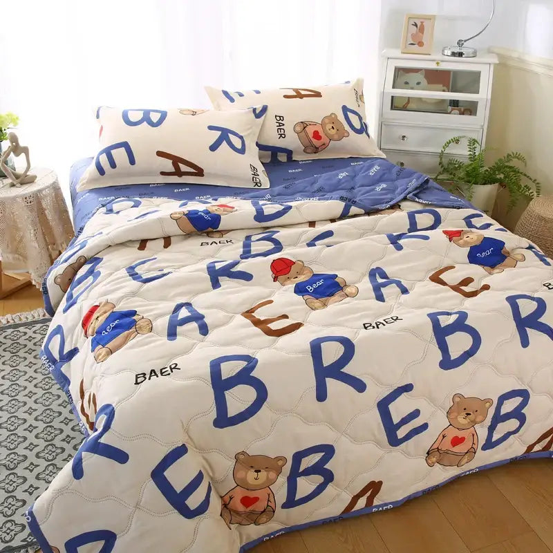 White quilted quilt set with cartoon bears and large blue letters on cream background for decorbites daisy print bedding