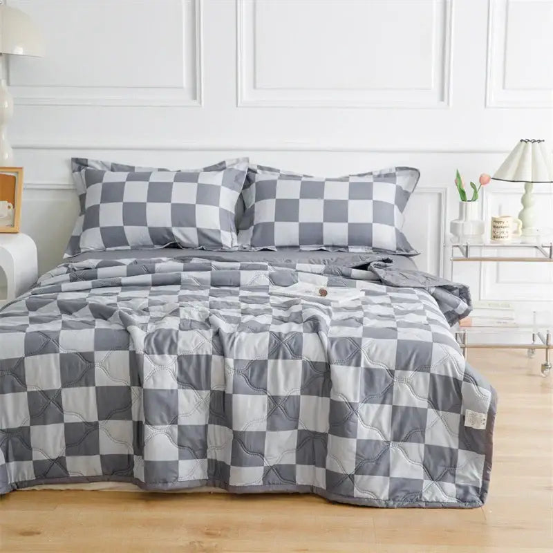 Gray and white checkered quilt set with plush texture complementing decorbites daisy print mint green bedding