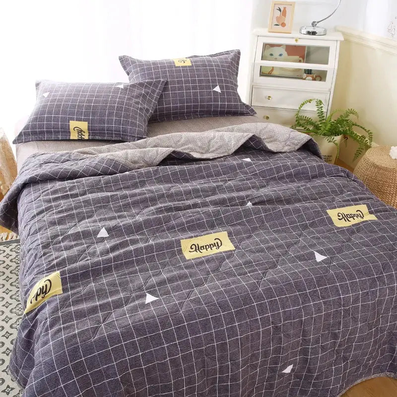 Gray quilted quilt set with white grid pattern and yellow happy patches in decorbites daisy print bedroom bedding