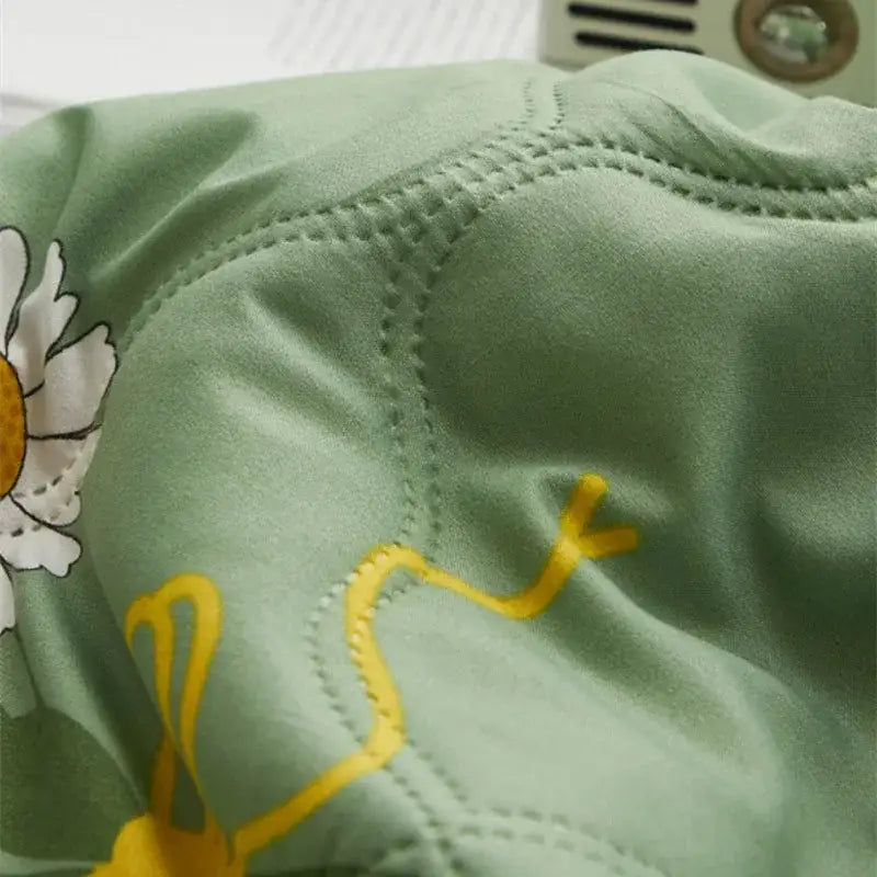 Mint green daisy print quilt set with delicate embroidered daisies and yellow vine pattern by decorbites