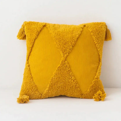 Vibrant mustard yellow diamond tassel cushion cover with textured corduroy fabric and plush tassels at each corner