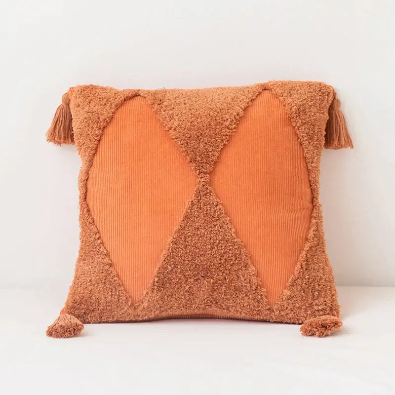 Cozy terracotta square tassel cushion cover with textured fuzzy fabric and corduroy x-pattern panels for living room use
