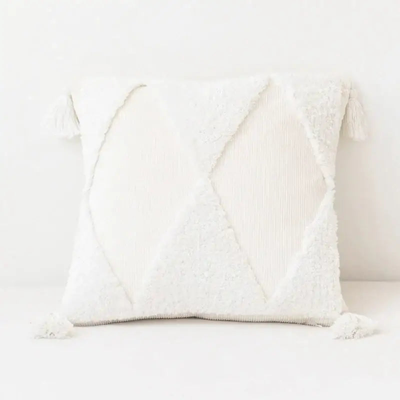 White textured cushion cover with geometric patchwork and tassels for a mint green diamond tassel cushion cover