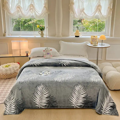 Gray plush blanket with white and black palm leaf pattern complementing decorbites dinosaur patterns snowflake velvet blanket