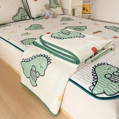 Mint green dinosaur summer quilt and latex fitted sheet set with white base and teal trim featuring dinosaur pattern