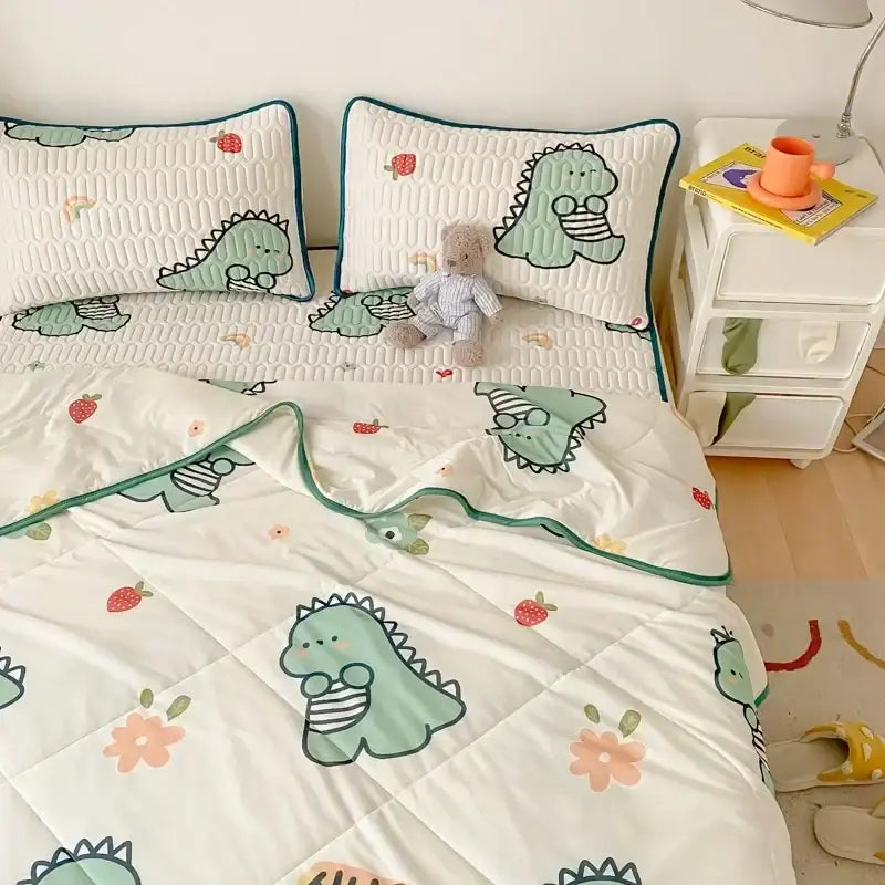 Mint green dinosaur summer quilt and latex fitted sheet set with strawberry and flower patterns on white background