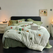 Soft mint green plush blanket with embroidered autumn tree motifs in matte ant velvet duvet set for bedroom use