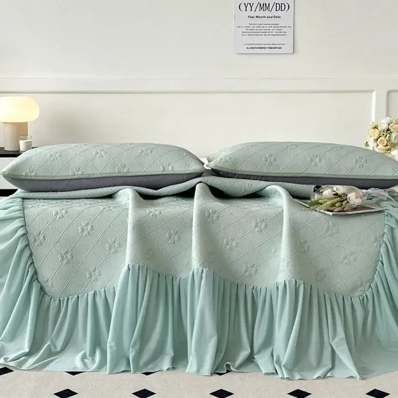 Mint green floral quilted bed skirt set with ruffled hem and floral embroidery for bedroom mattress mat