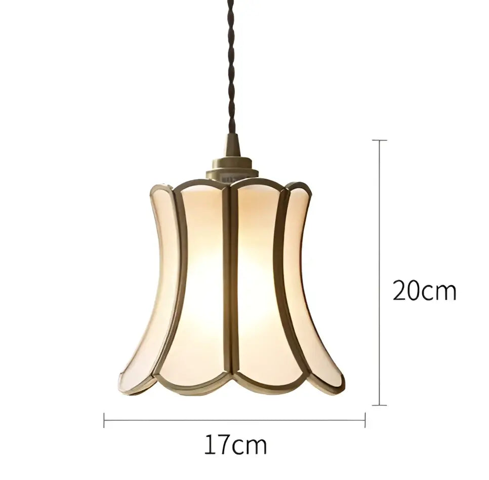 Vintage-style wall lamp sconce with cream glass shade brass trim and twisted black cord for bedroom lighting