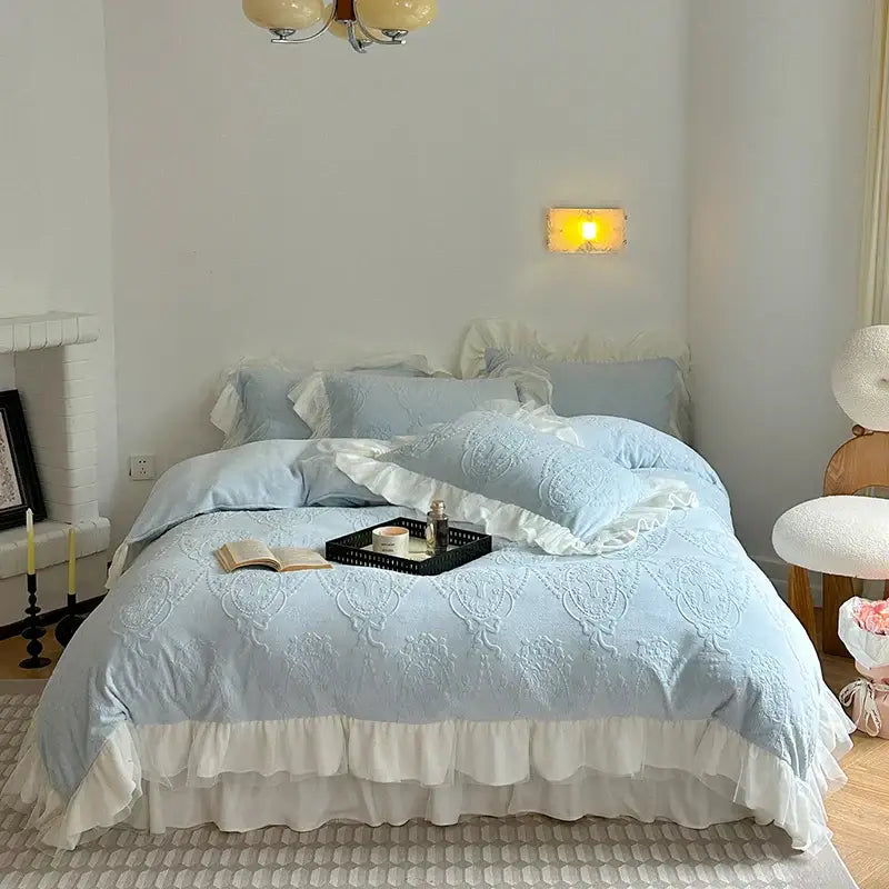 Light blue embroidered bedding set with white ruffles and lace trim from decorbites french carved velvet collection