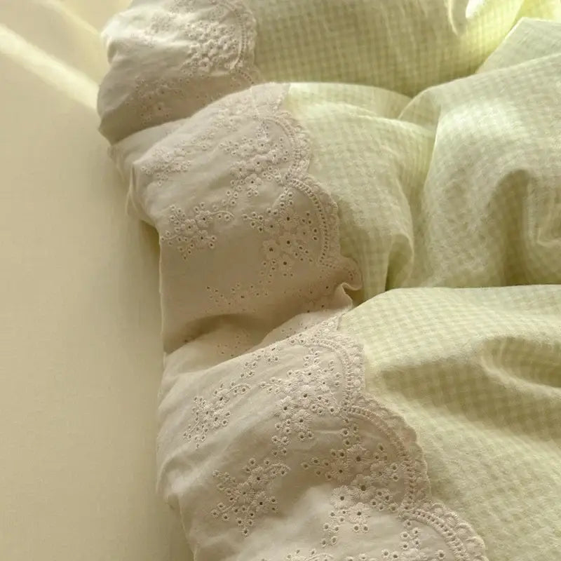 Off-white quilted duvet cover with floral embroidery and scalloped edges in mint green french lace washed bedding sets