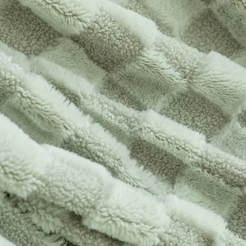 A soft plush sofa cover in creamy white and muted gray fleece featuring decorbites geometric jacquard flannel pattern