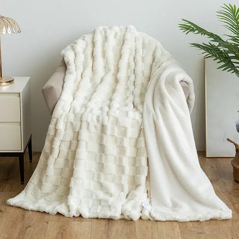 Cream-colored faux fur throw blanket with textured woven pattern paired with mint green geometric jacquard flannel sofa cover for living room decorbites geometric jacquard style