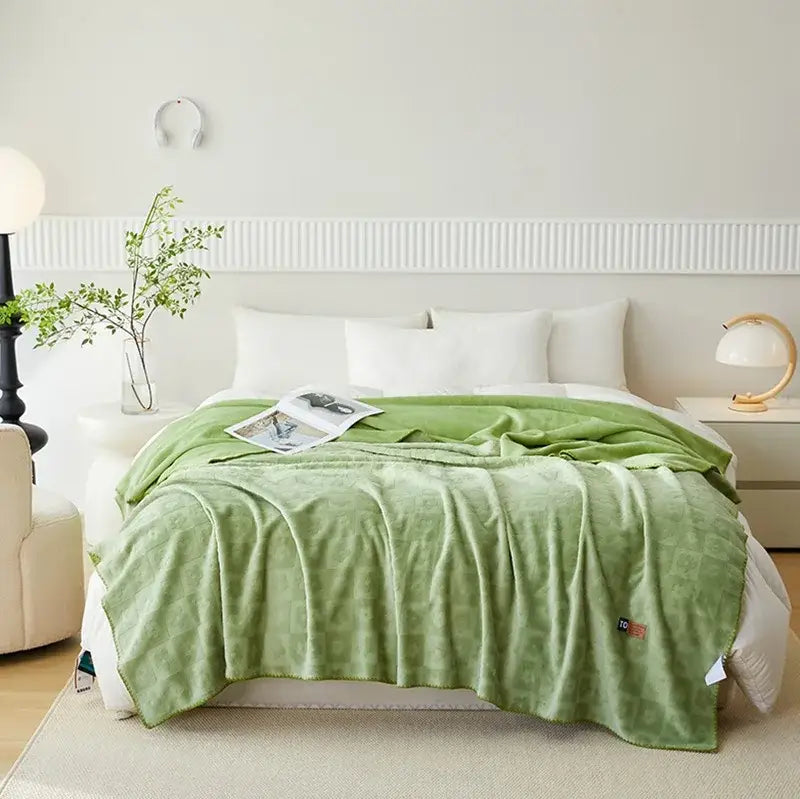 Mint green jacquard milk velvet throw blanket with subtle texture ideal for bedroom decor and travel comfort by decorbites