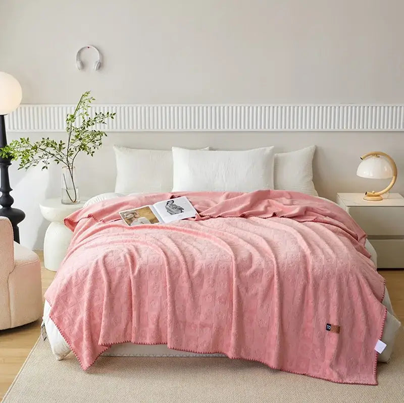 Soft pink textured throw blanket with fringed edges made of jacquard milk velvet ideal for decorbites jacquard milk use