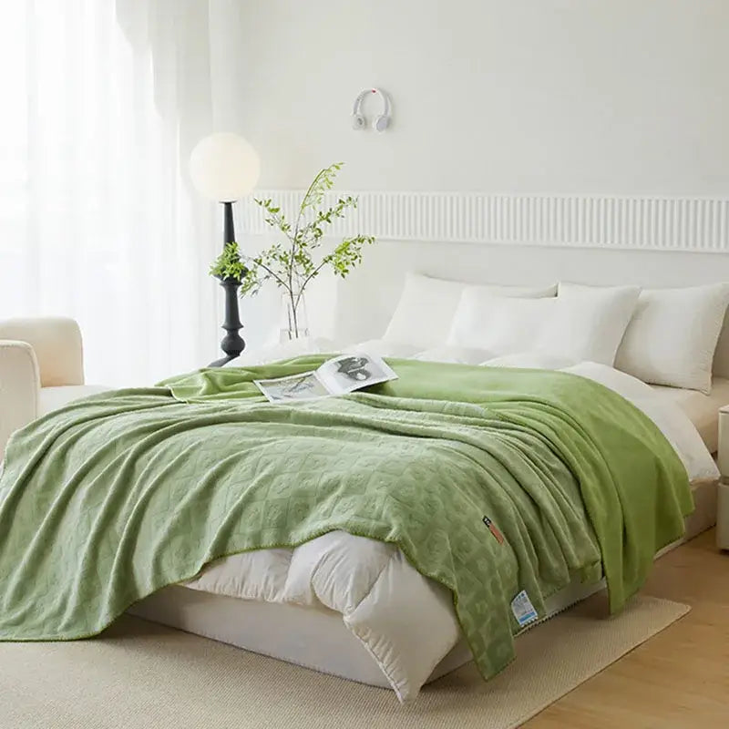 Soft mint-green jacquard milk velvet quilted throw blanket draped over bed for decorbites jacquard milk velvet use