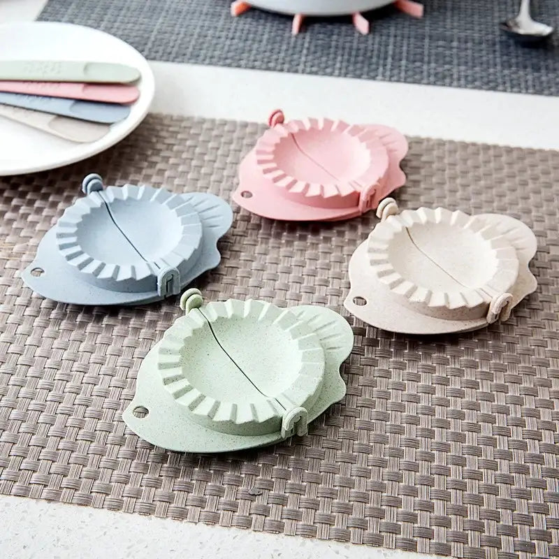 Pastel-colored silicone dumplings maker tool in soft pink blue green and beige cooking kitchen accessory