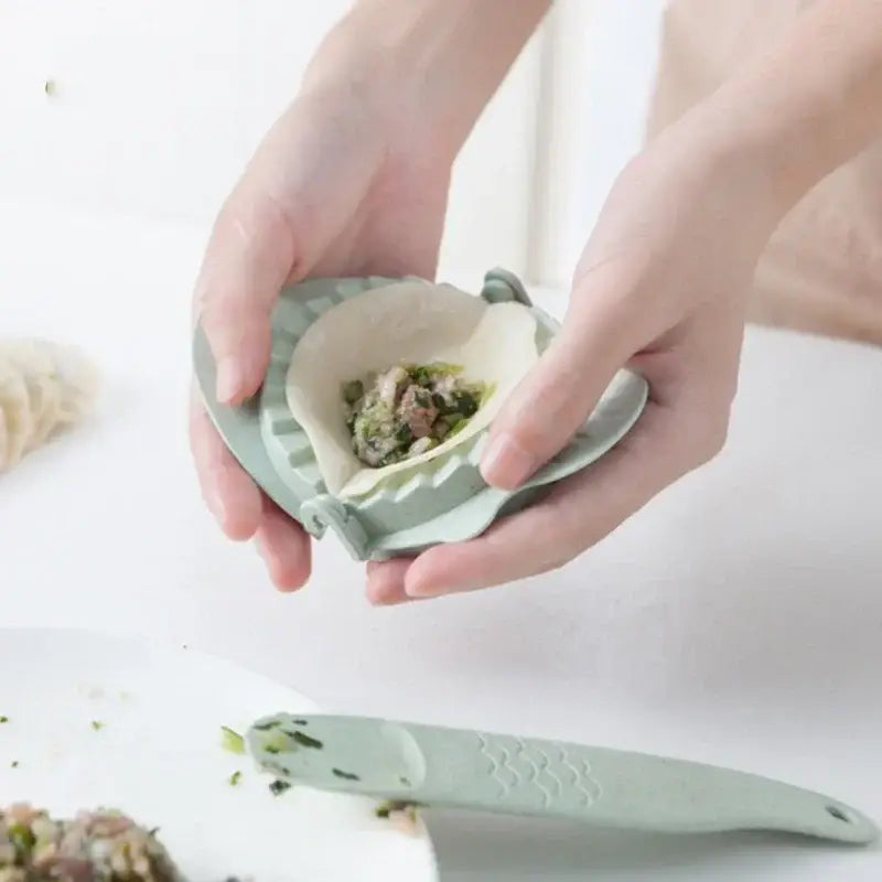 Mint green leaf silicone dumplings maker tool with hinged design and scalloped edges for easy dumplings making
