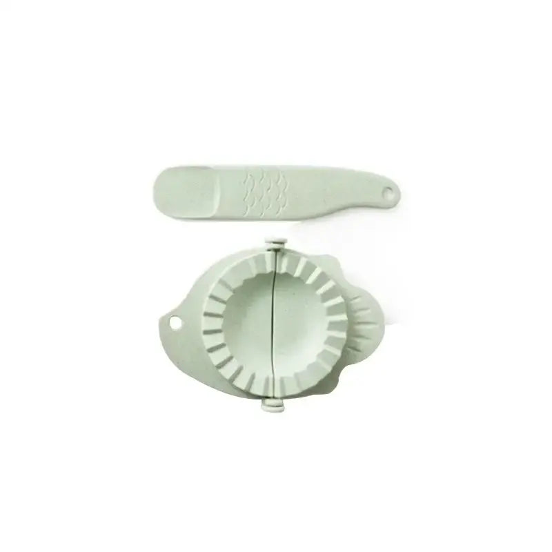 Mint green leaf silicone dumplings maker tool with matching light green plastic press tool for easy dumplings making