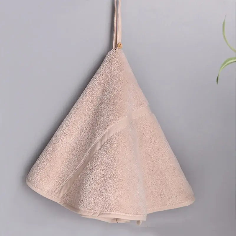 A blush terry cloth baby towel with fabric loop and wooden button in mint green and off-white decorbites coral velvet hand towel set
