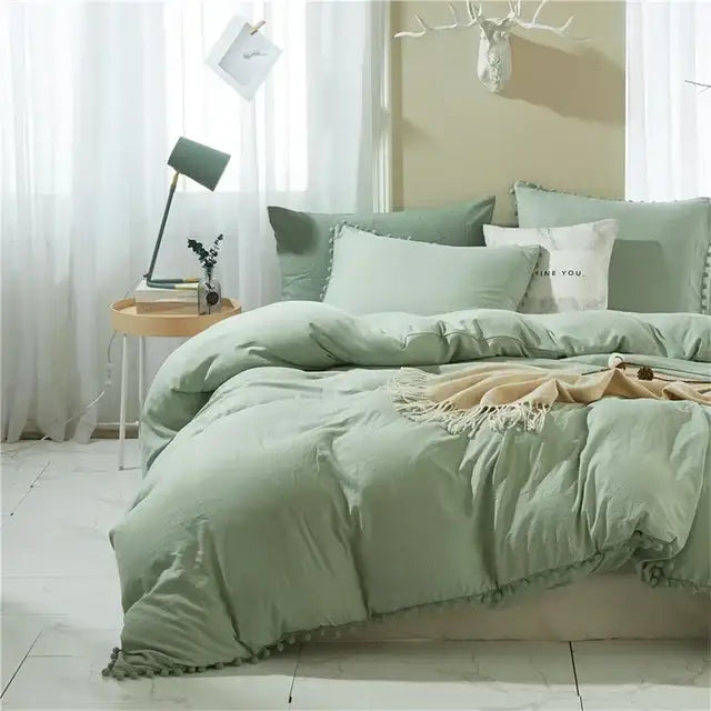 Mint green quilted duvet cover set with soft tassel trim featuring pom pom detail for bedroom decor