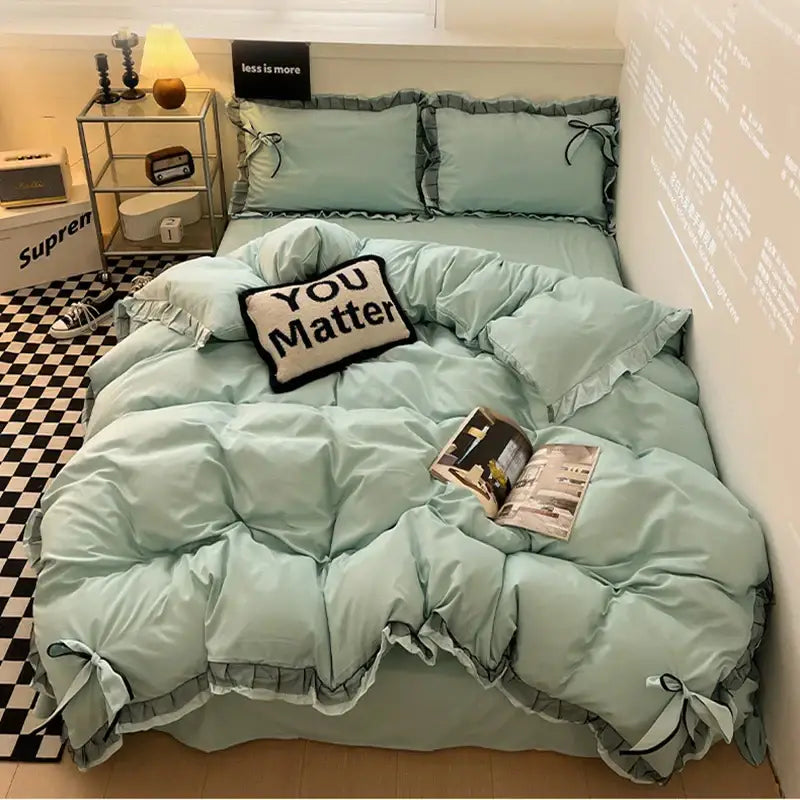 Mint green ruffled cotton embroidery bedding set with matching pillows and you matter throw pillow by decorbites