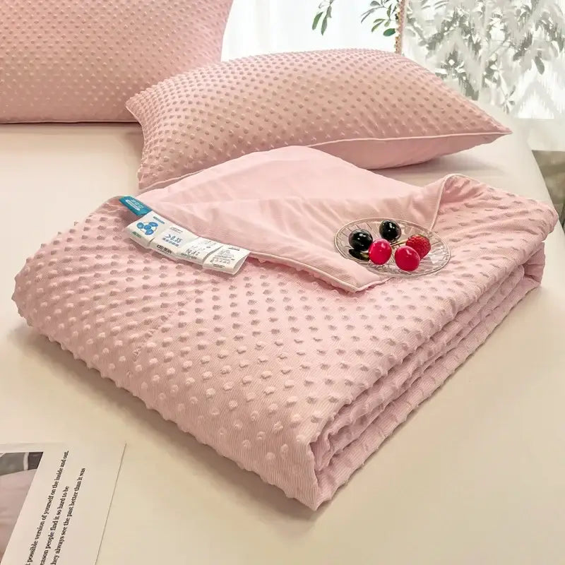 Pink textured cooling massage blanket with soft dotted surface by decorbites for bedroom comfort and decorbites cooling massage