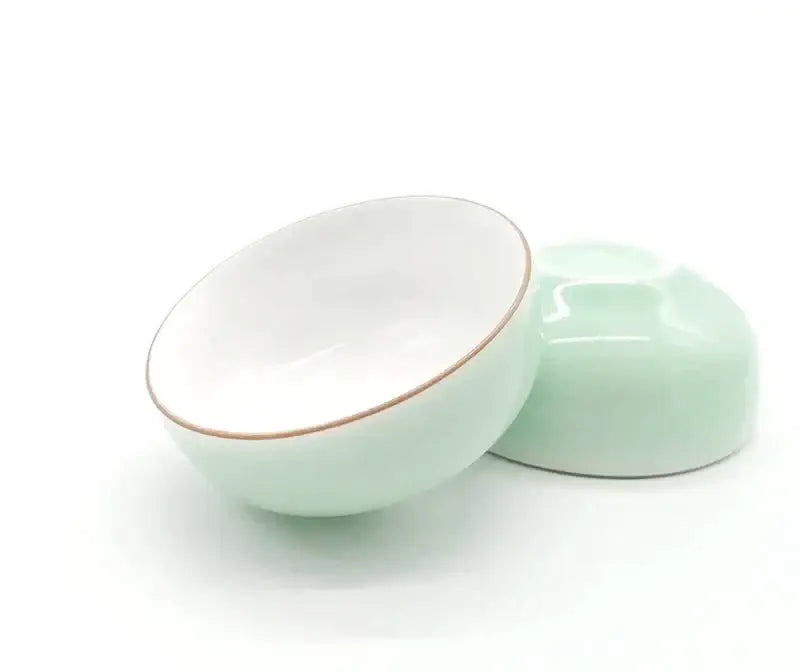 Delicate mint green and white celadon tea cup set with gold rim porcelain by decorbites for elegant dining room decor