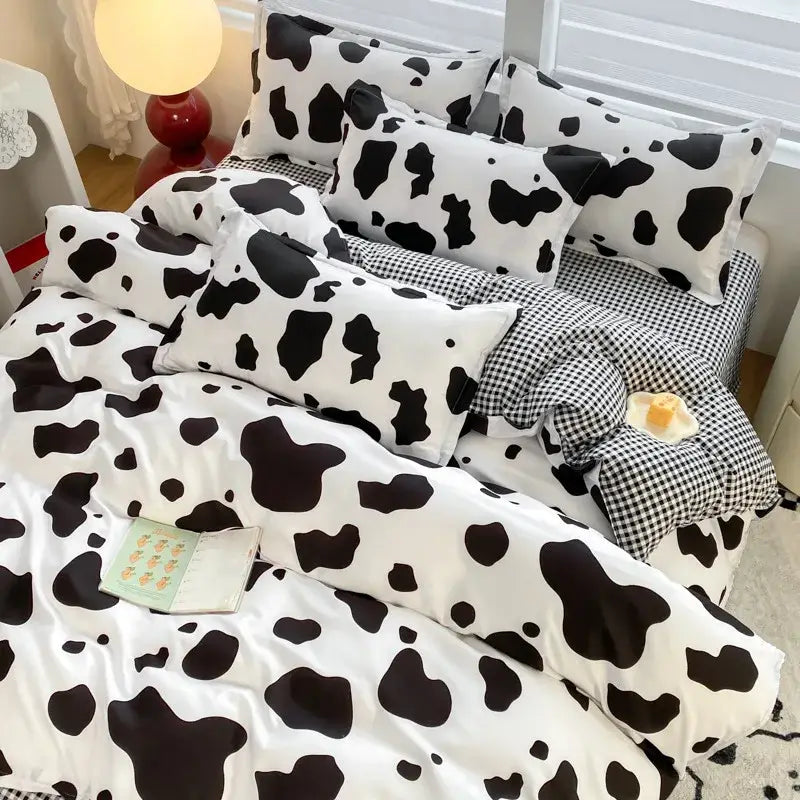 Black and white cow print bedding set with soft smooth fabric finish contrasting mint green and white ginkgo leaf cartoon print decorbites cartoon print