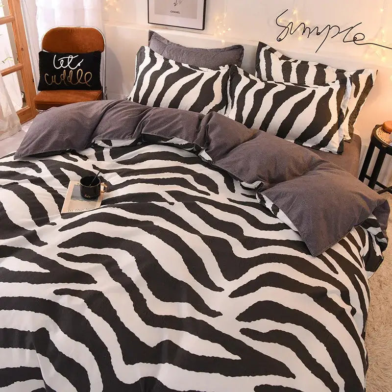 Black and white zebra-striped bedding set with bold graphic pattern complementing decorbites cartoon print bedroom decor