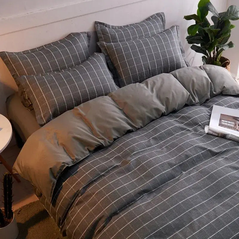 Gray and white checkered duvet set with soft quilted texture complementing a mint green and white ginkgo leaf cartoon print bedding set by decorbites cartoon print