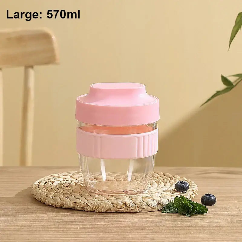 Pink silicone lid and grip band on clear glass decorbites breakfast cup kitchen food container in mint green and yellow