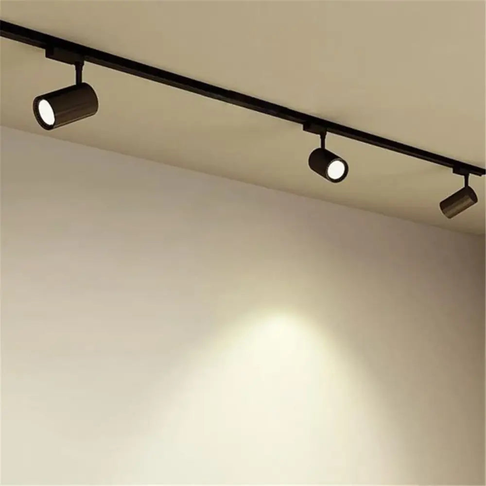 Black cylindrical track lights with adjustable heads on a 100cm black white rail for living room decorbites 100cm black