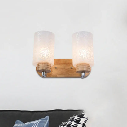 DecorBites™ DecorBites™ Modern 2-headed White Glass Cylinder Wall Sconce with Wood Wall Mount and Rose Pattern