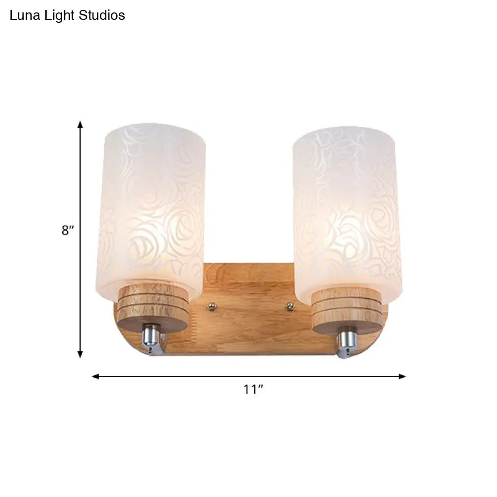 DecorBites™ DecorBites™ Modern 2-headed White Glass Cylinder Wall Sconce with Wood Wall Mount and Rose Pattern