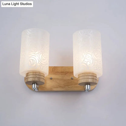 DecorBites™ DecorBites™ Modern 2-headed White Glass Cylinder Wall Sconce with Wood Wall Mount and Rose Pattern