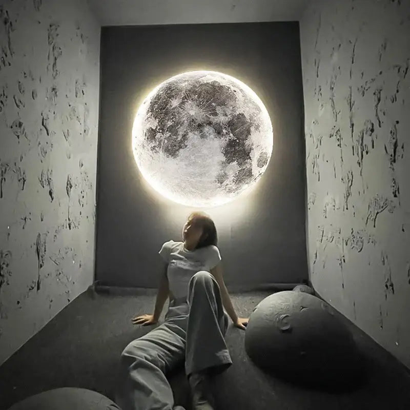 A glowing detailed 3d creative moon earth led wall lamp mounted on a dark wall for bedroom decorbites creative moon decor
