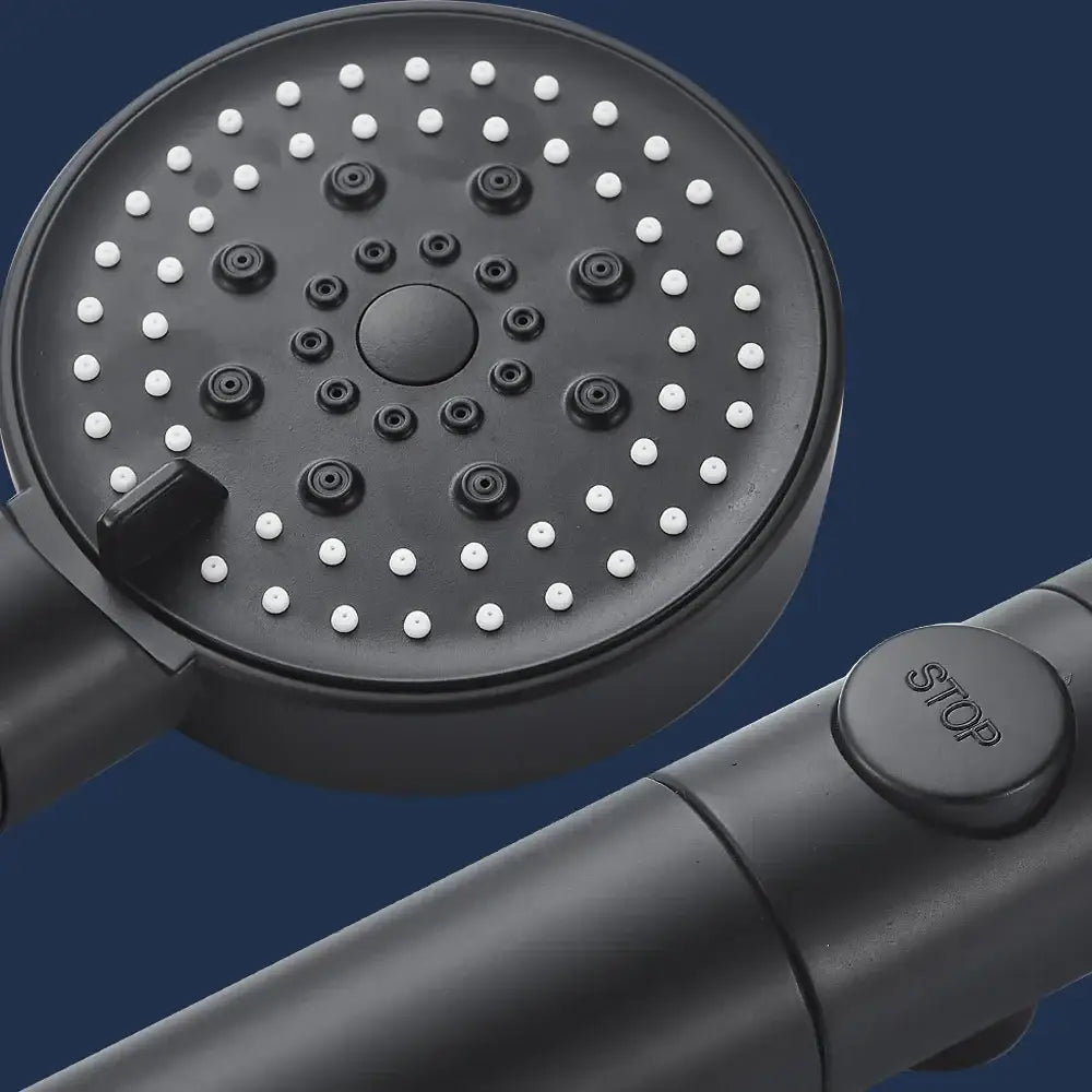 Modern 5-function shower head with black matte finish white nozzles and central control knob for versatile use