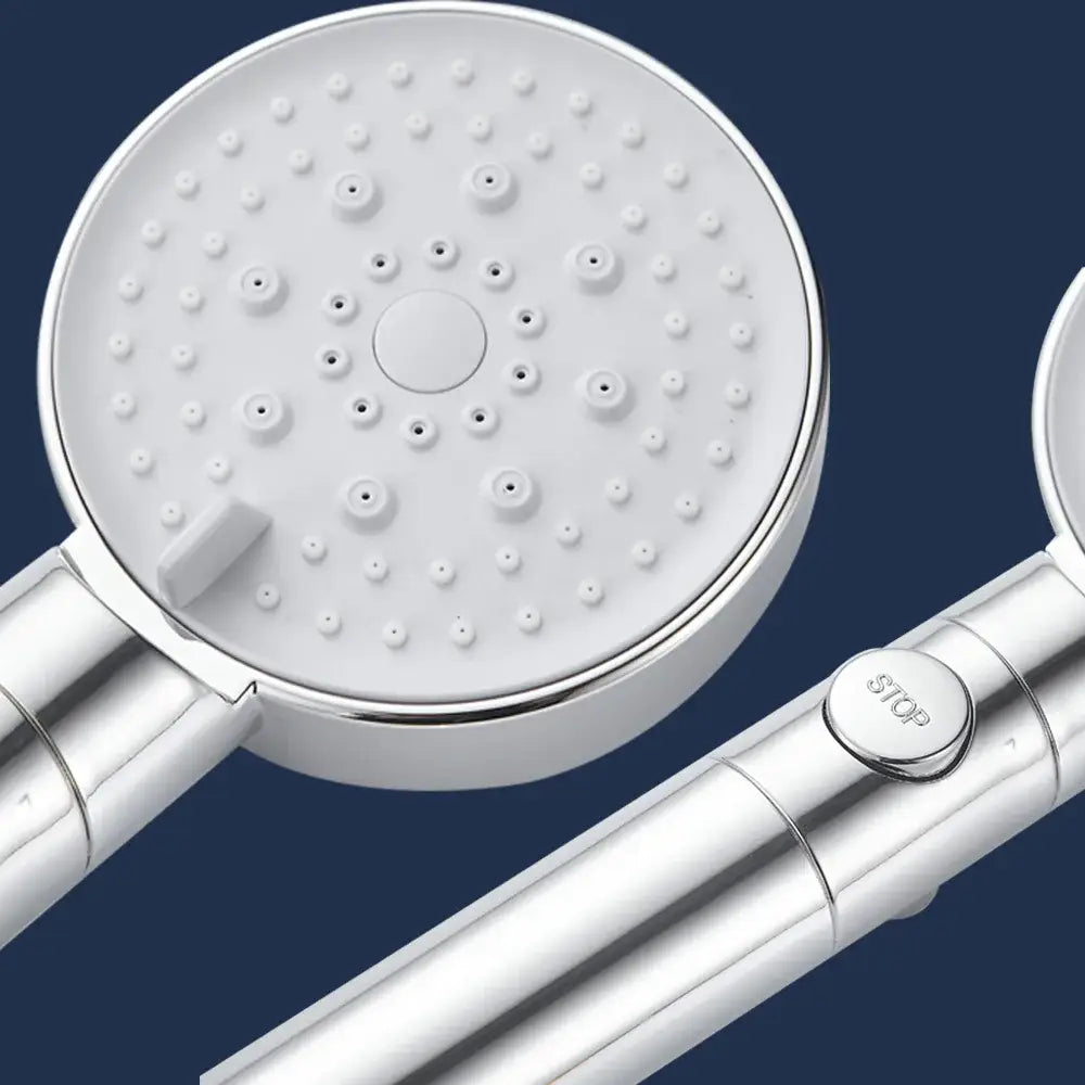 Silver-finished handheld 5-function shower head with white circular spray face and central control button for bathroom use