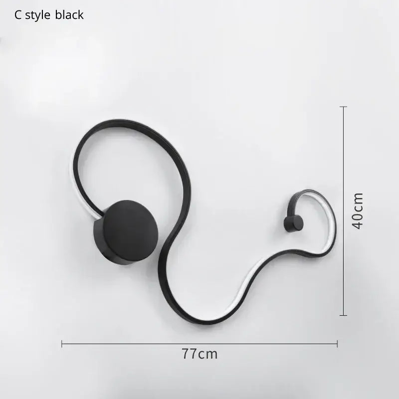 Modern abstract black iron body led wall lamp with sleek curved metallic frame for bedroom decorbites iron body sconce