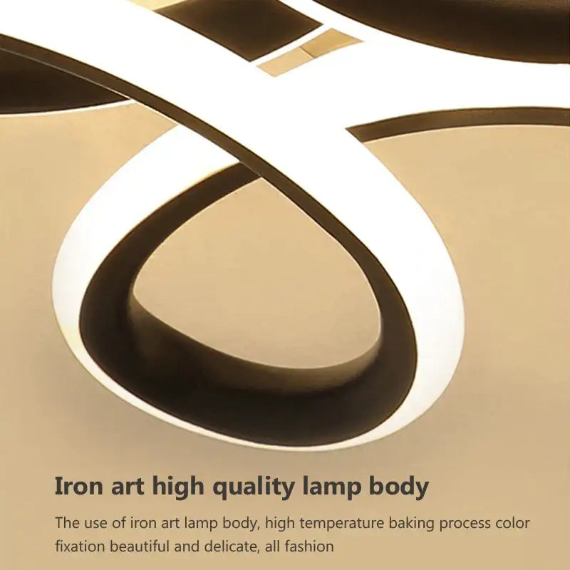 Modern abstract black and white iron led ceiling light with sleek flowing design for kitchens by decorbites ceiling light