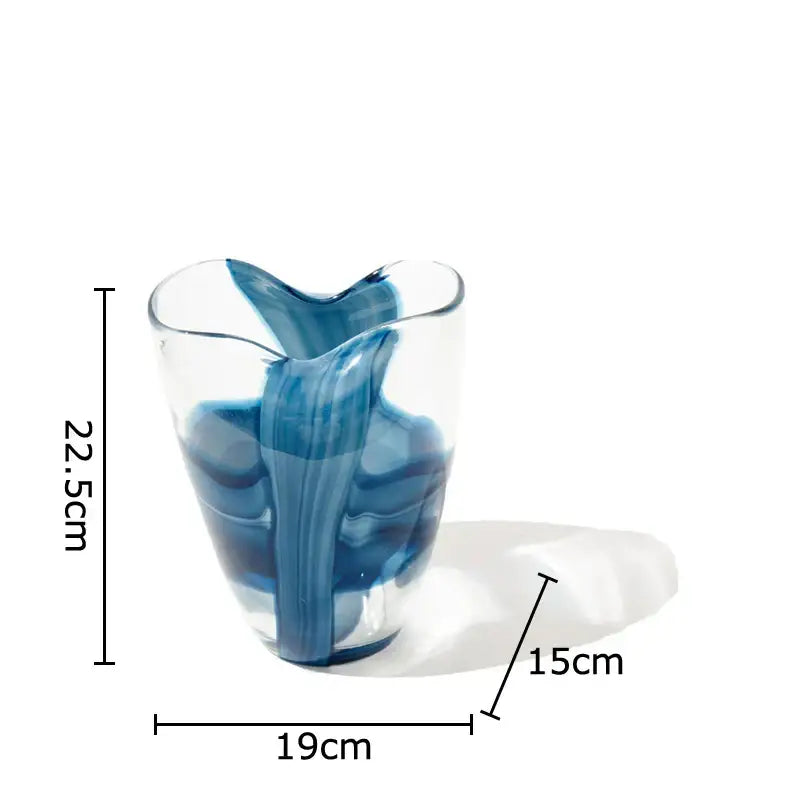 A translucent glass vase with blue striped abstract swirl design and heart-shaped opening for modern decorbites decor