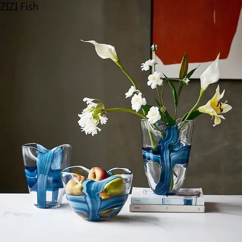 Clear glass vase with blue striped resin design holding white and yellow calla lilies for decorbites blue striped decor