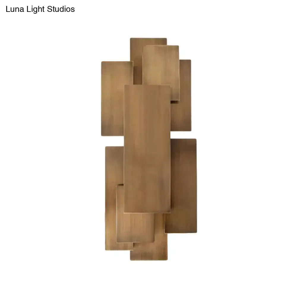 Modern abstract dark wood wall sconce with brass overlapping rectangular plates direct wired 220v-240v stairway light