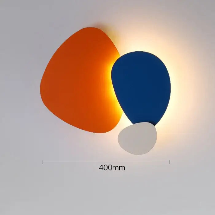 Modern abstract geometric art wall lamp with three overlapping organic shapes in orange blue and white for bedroom and living room