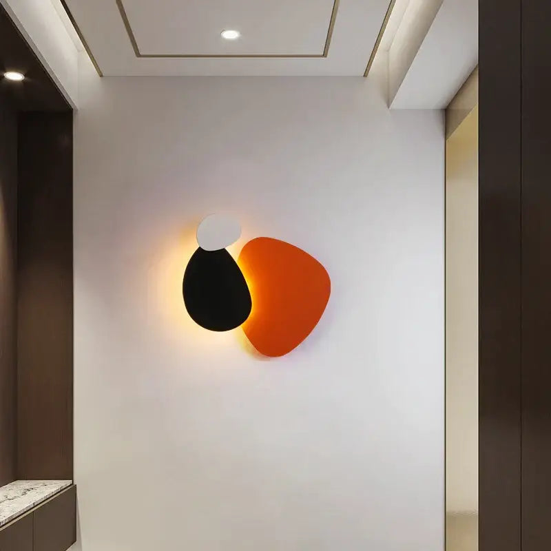 Modern abstract geometric art wall lamp with overlapping black white and orange shapes for bedroom and living room