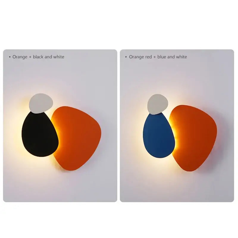 Modern abstract geometric art wall lamp with overlapping orange and black teardrop panels and white accent for bedroom and living room