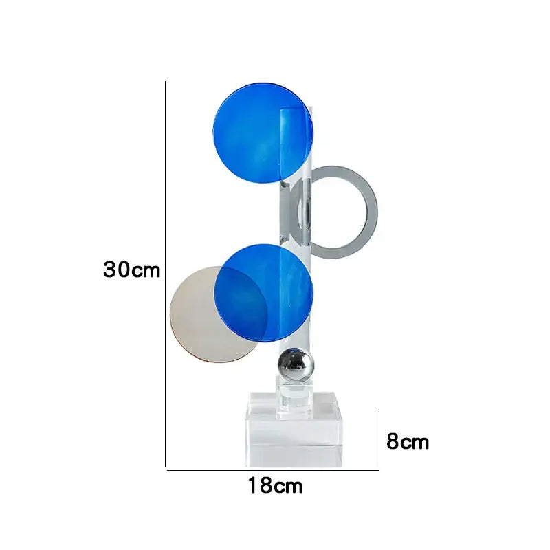 A modern abstract geometric crystal ornaments ring sculpture with translucent blue and silver elements on acrylic base